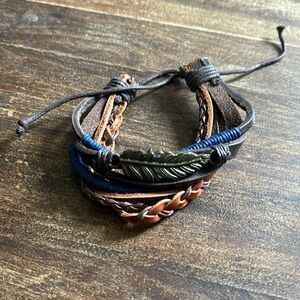 Leather bracelet with feather accent